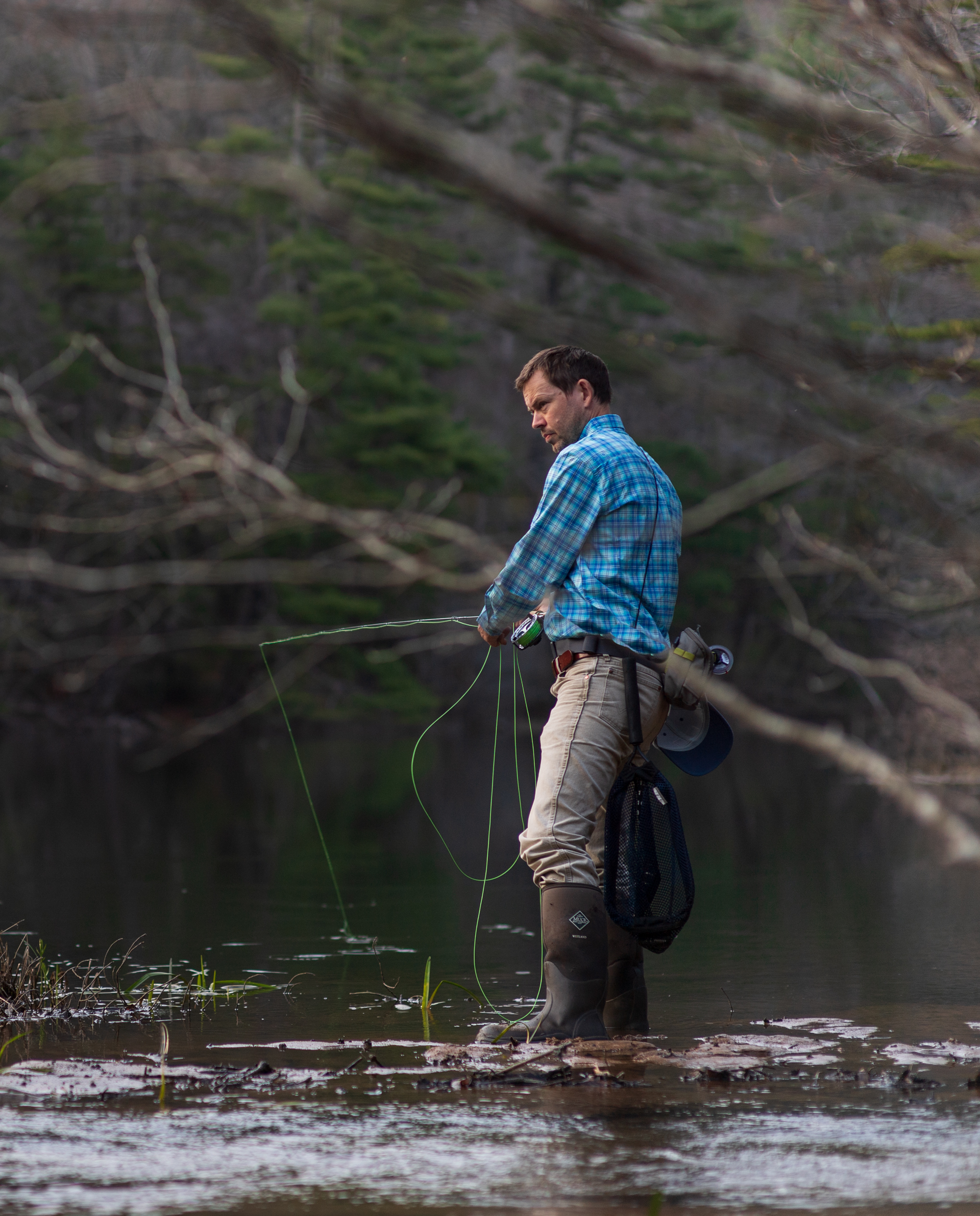 fly fisherman in North Georgia mountains stream photographed by Dailyn Matthews Adventure Photographer