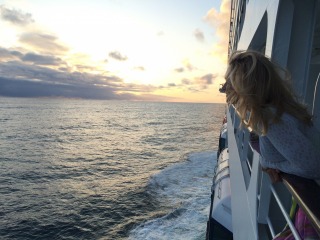 Adventure Photographer Dailyn Matthews watching the sea go by on an Oceania cruise ship to Alaska