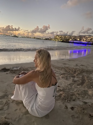 Adventure Photographer Dailyn Matthews on the beach watching the sunset at Simpson Bay on Sint Maarten, the French West Indies