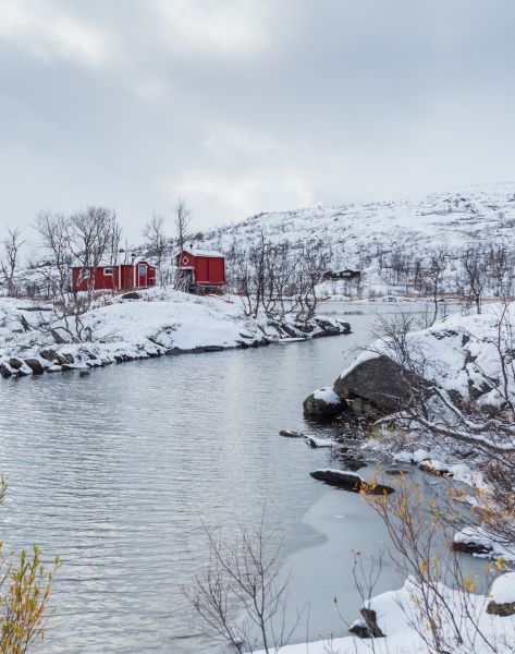 Traditional red huts in Abisko, Norway photographed by Adventure Photographer, Dailyn Matthews