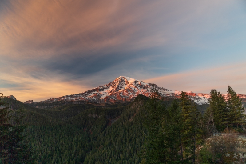 Mount Rainier bathed in the setting sun creating alpenglow photographed by Adventure Photographer, Dailyn Matthews