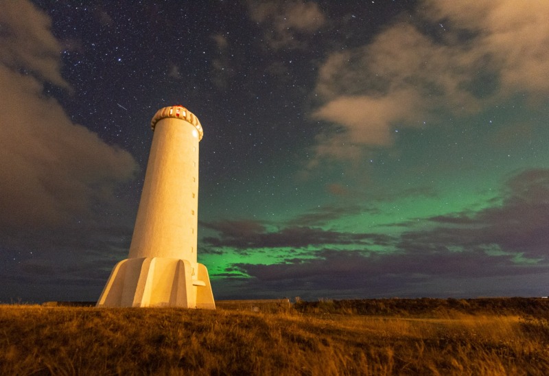 Akranes Light under the Aurora Borealis / Northern Lights in Iceland photographed by Adventure Photographer, Dailyn Matthews